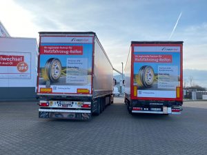 Beschrifteter Sattelauflieger mit First-Stop-Werbung